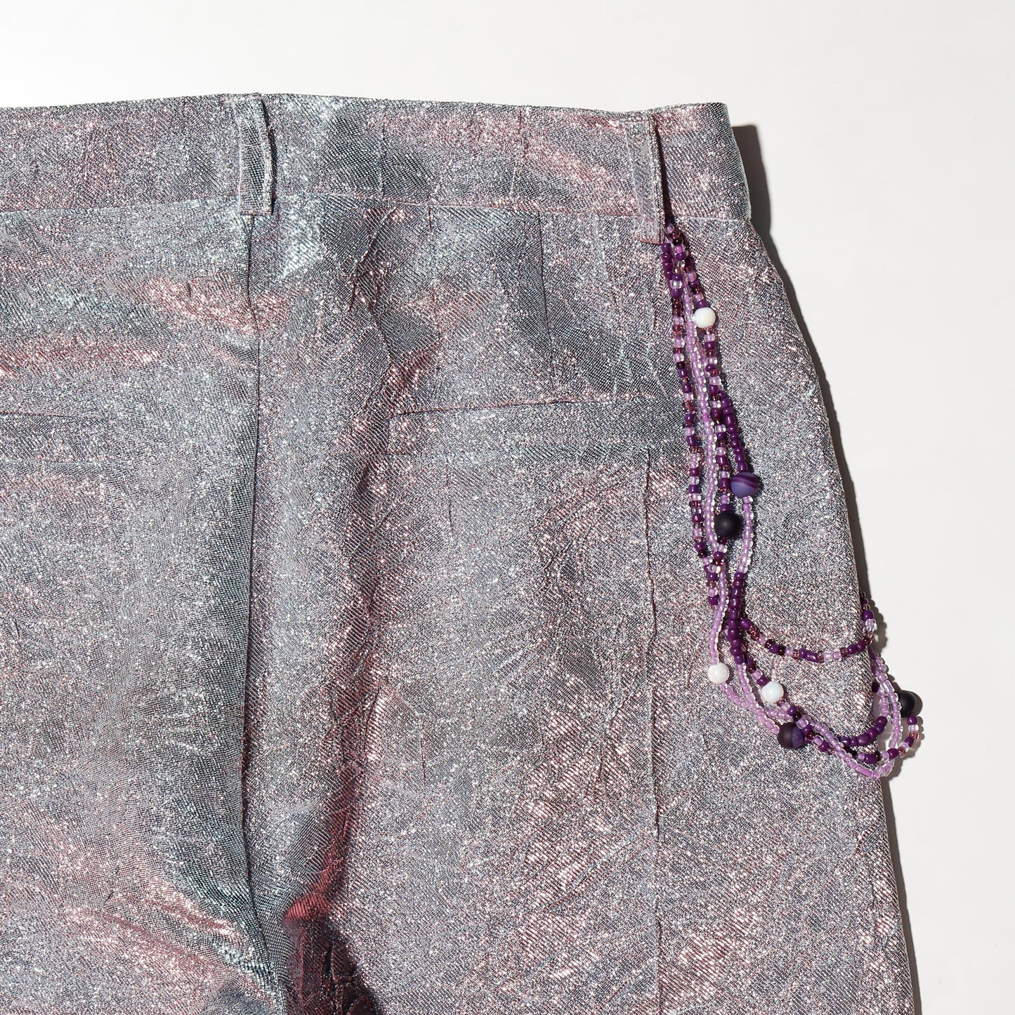 vintage holographic costume trousers, with beaded chain