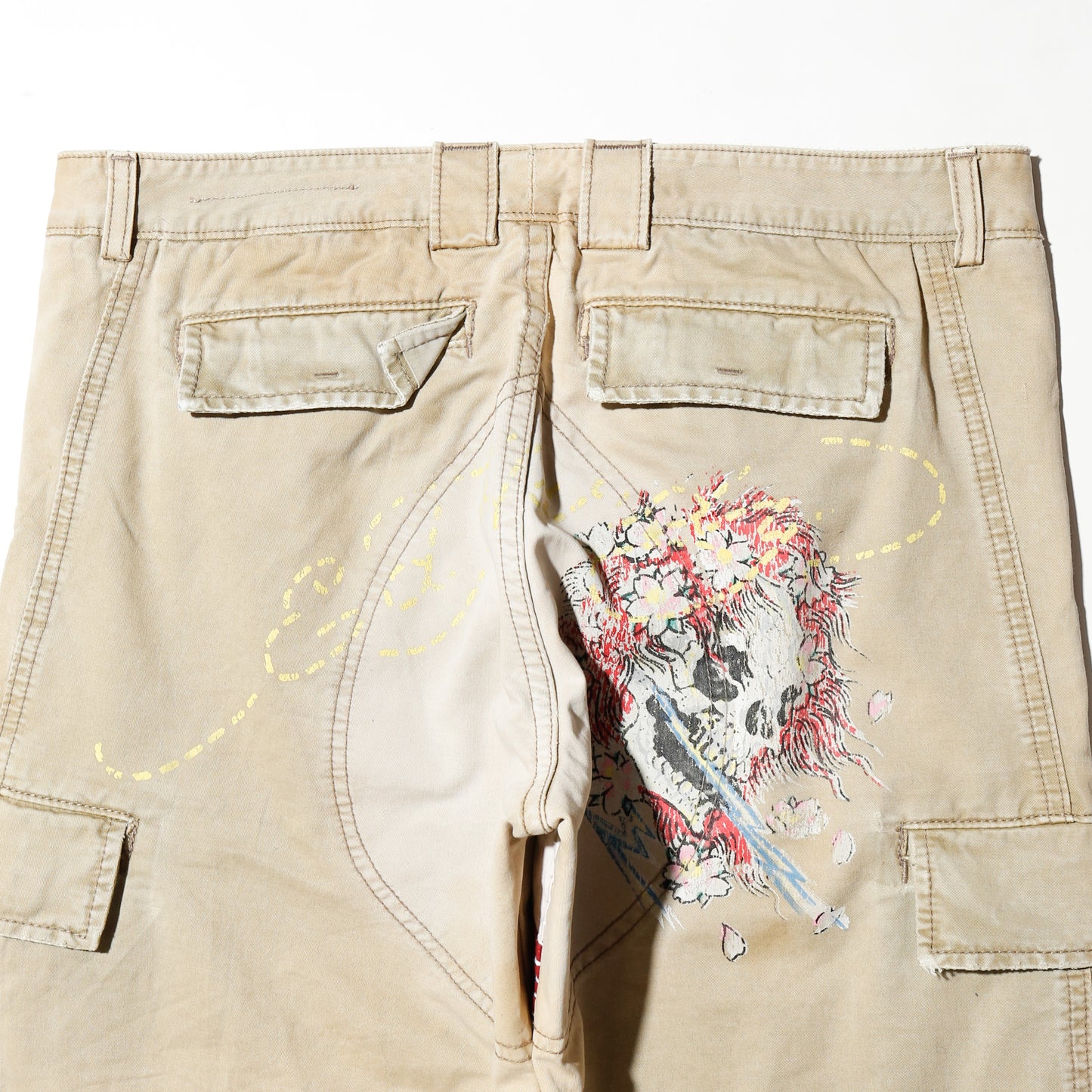 *one-off ed hardy repaired trousers, with copper badge