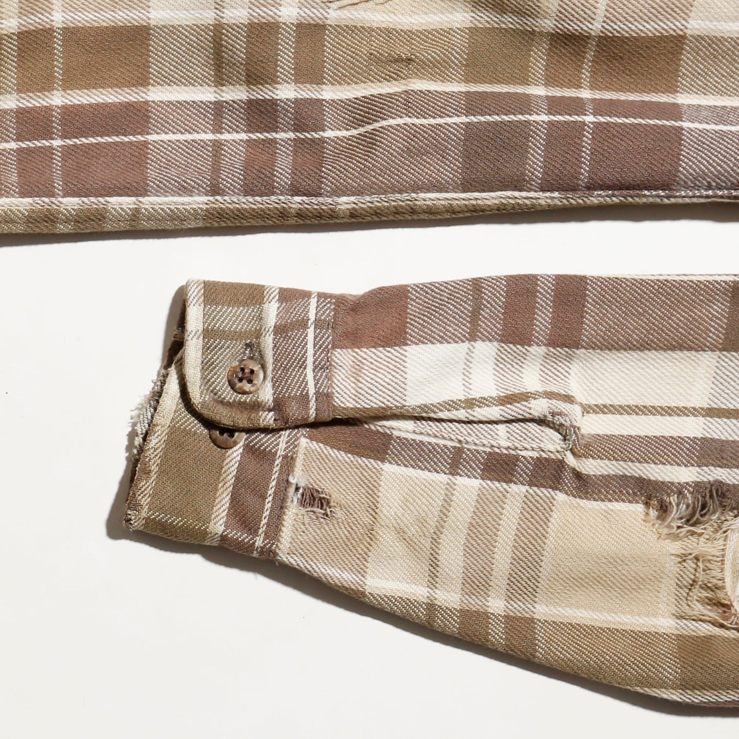 *one-off broken flannel check shirt, with copper badge