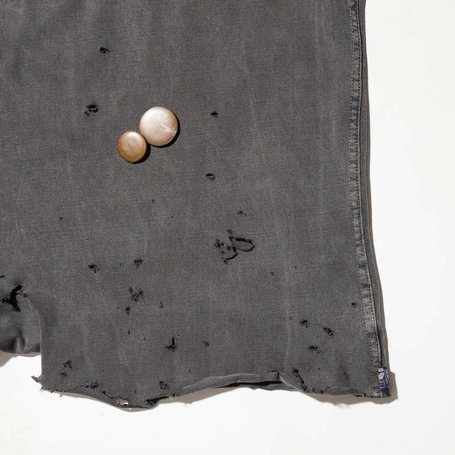 *one-off broken polo shirt, with copper badge