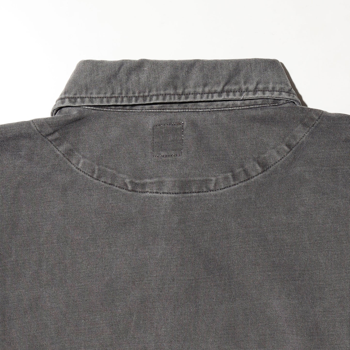 *one-off broken polo shirt, with copper badge
