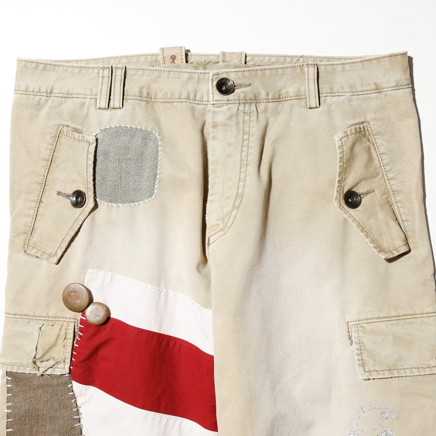 *one-off ed hardy repaired trousers, with copper badge