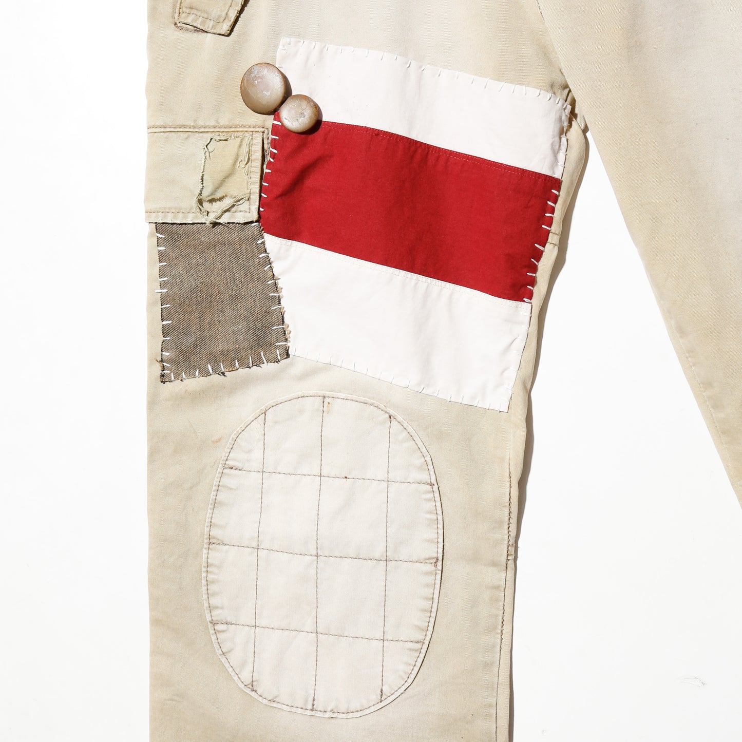 *one-off ed hardy repaired trousers, with copper badge