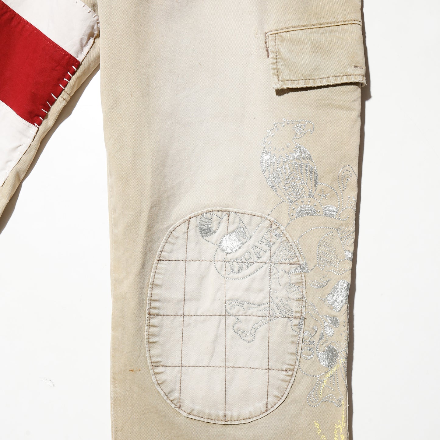 *one-off ed hardy repaired trousers, with copper badge