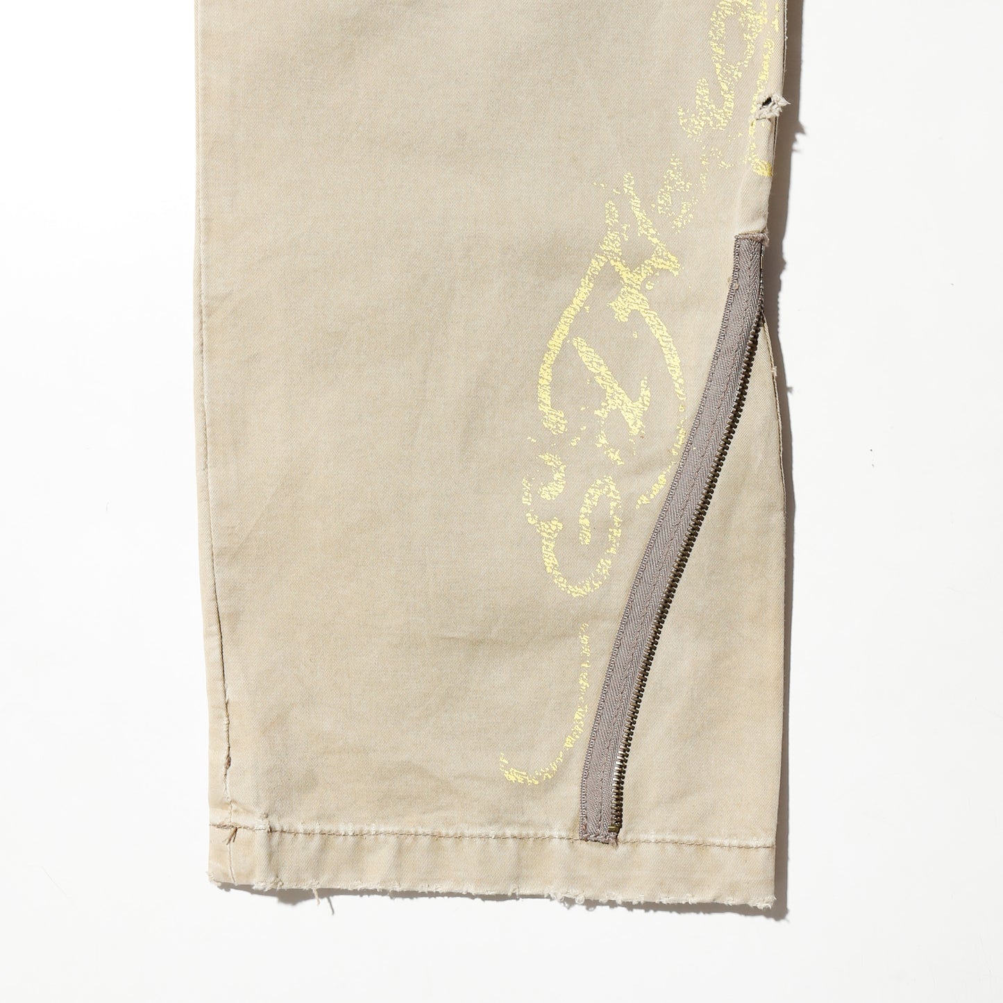 *one-off ed hardy repaired trousers, with copper badge