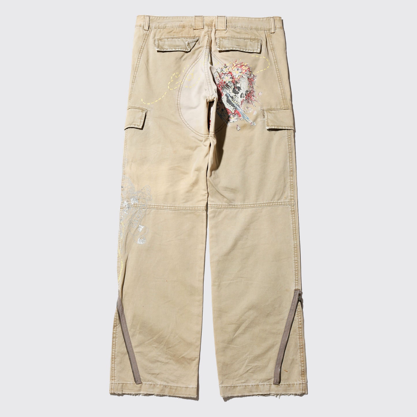 *one-off ed hardy repaired trousers, with copper badge