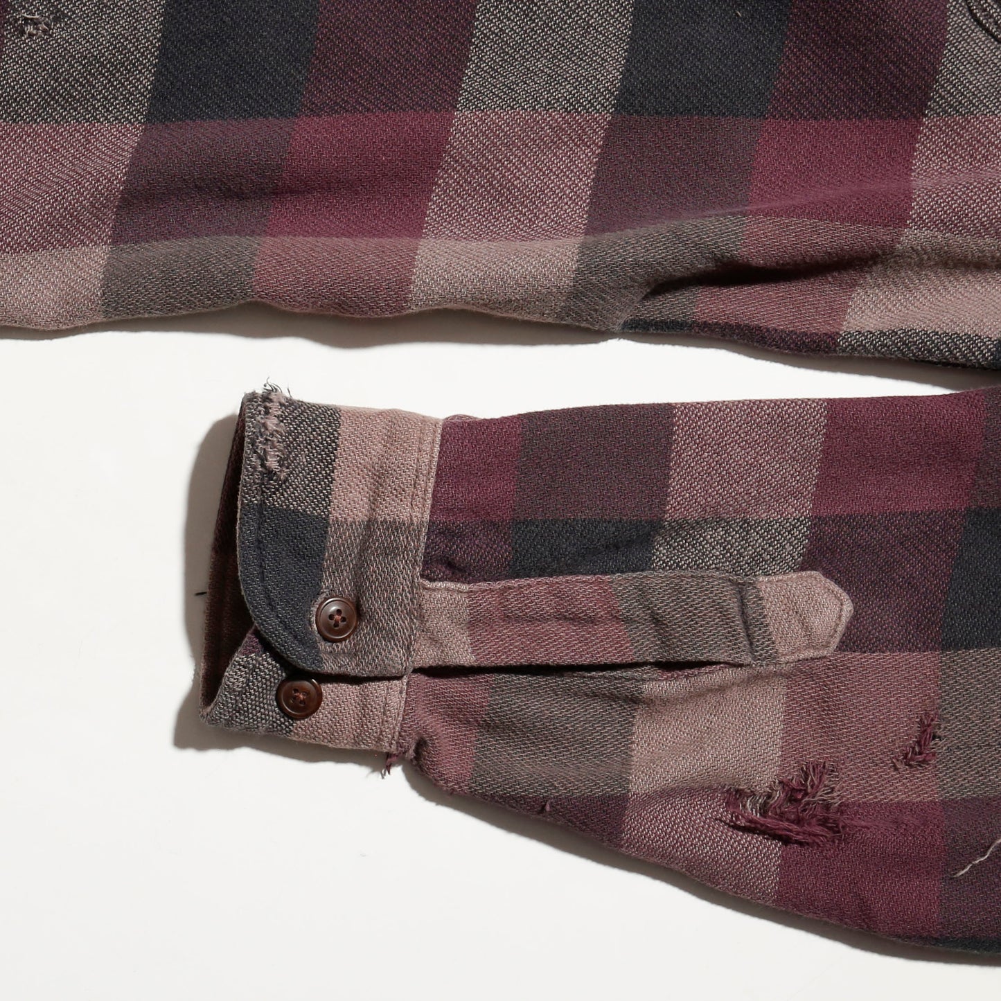 *one-off broken flannel check shirt, with copper badge