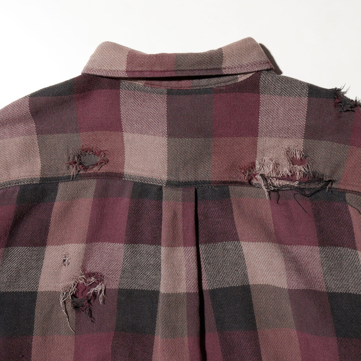 *one-off broken flannel check shirt, with copper badge