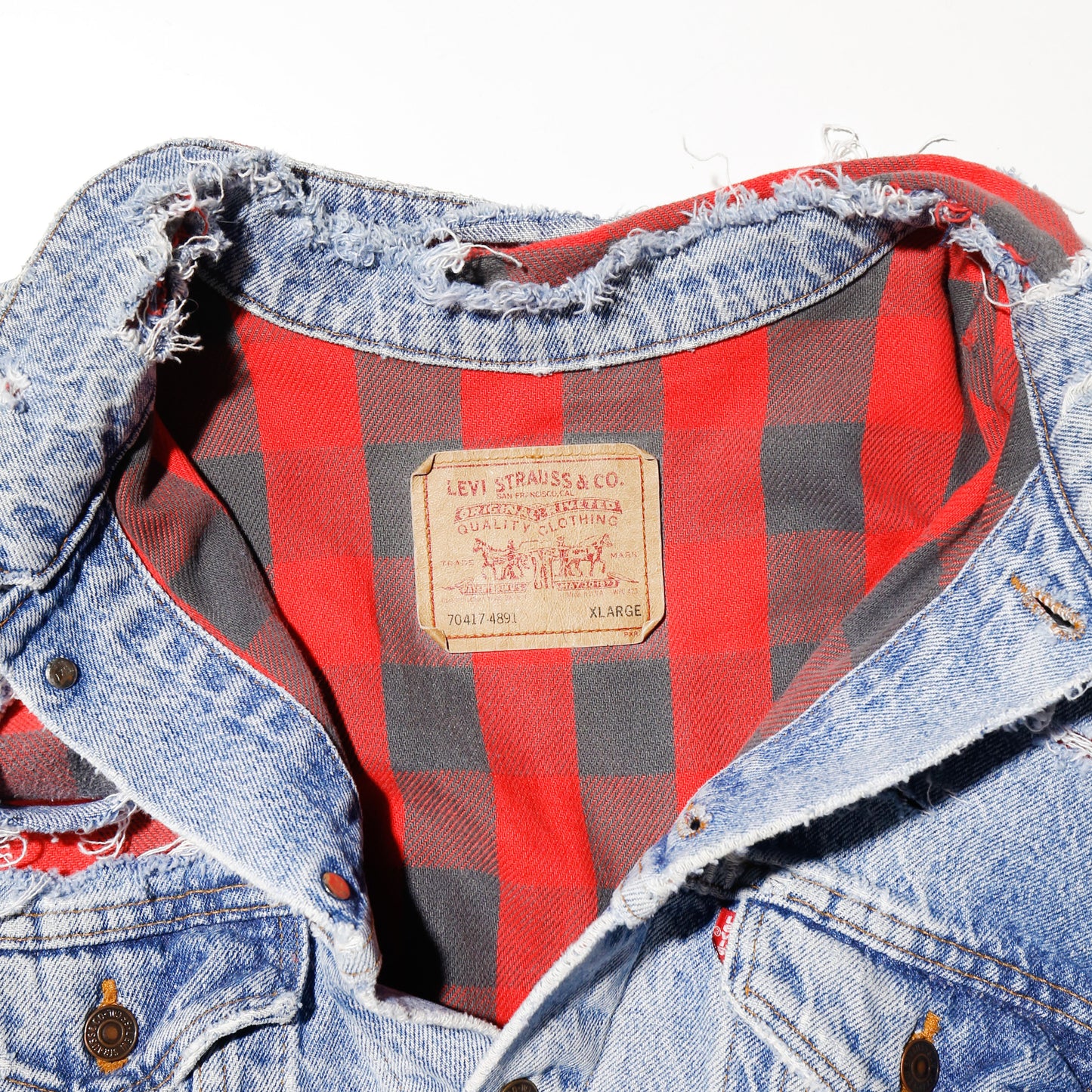 *one-off 90's Levi's broken trucker jacket , with check liner