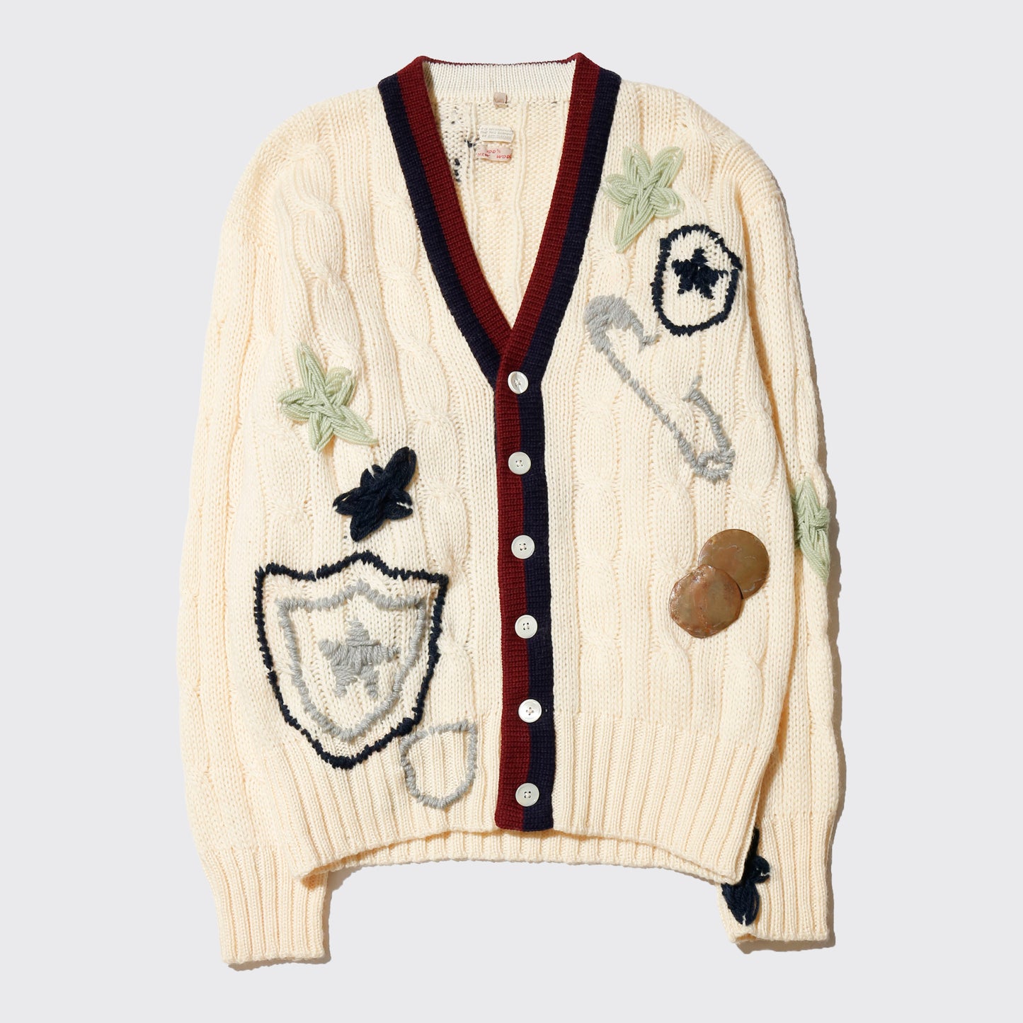 *one-off craft cricket cardigan, with copper badge
