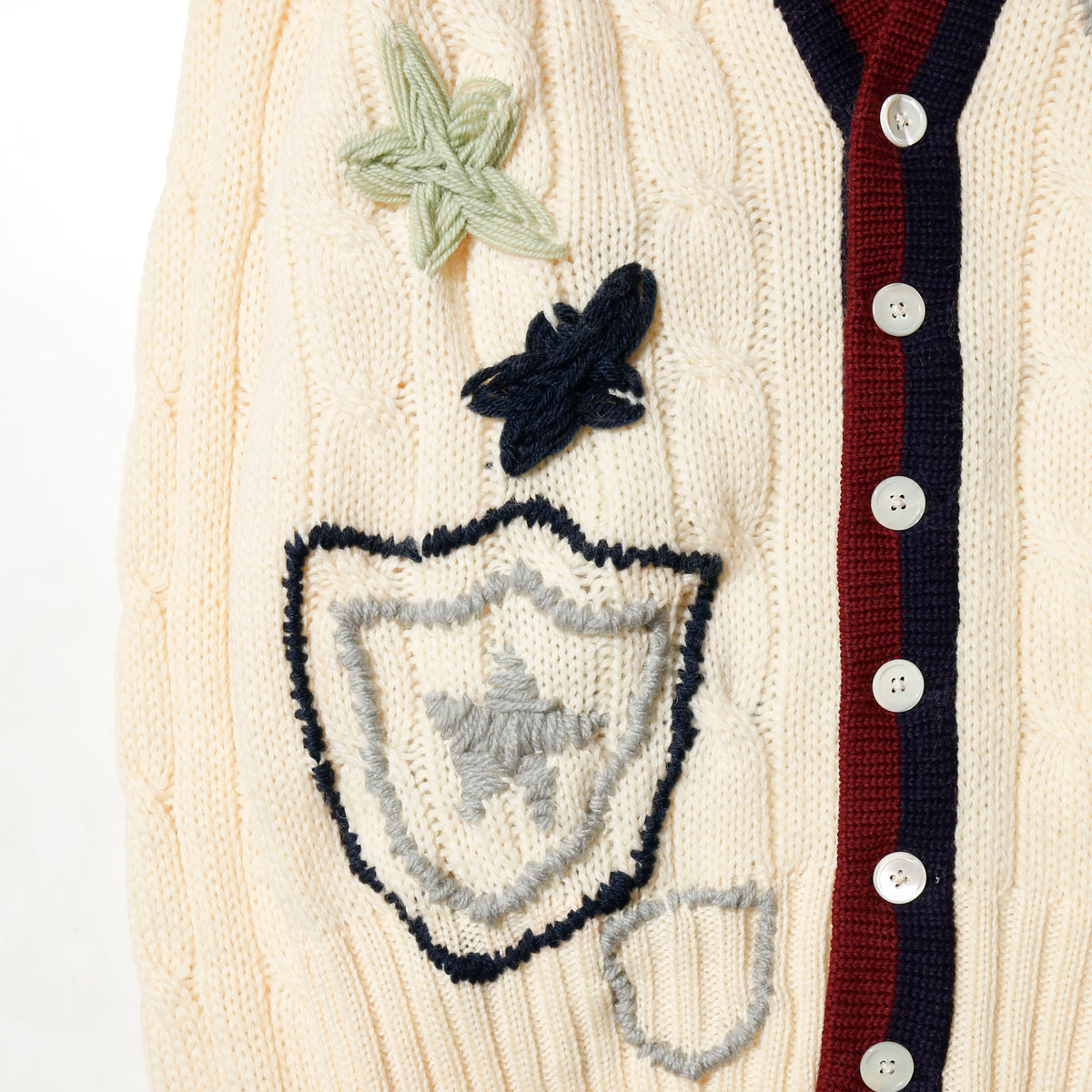 *one-off craft cricket cardigan, with copper badge