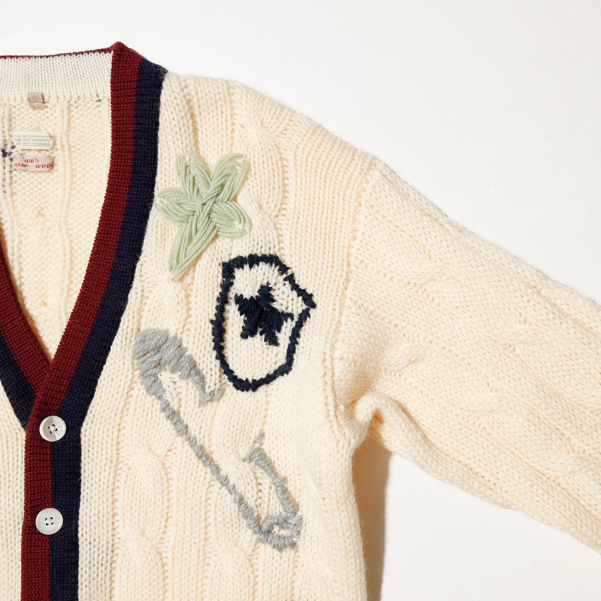 *one-off craft cricket cardigan, with copper badge