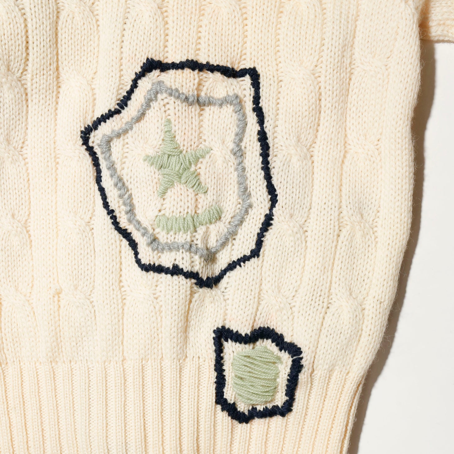 *one-off craft cricket cardigan, with copper badge