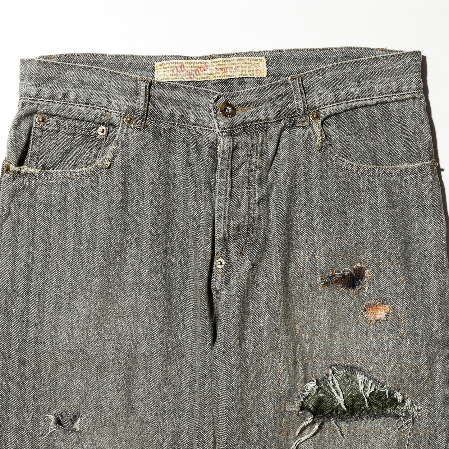 *one-off repaired herringbone jeans