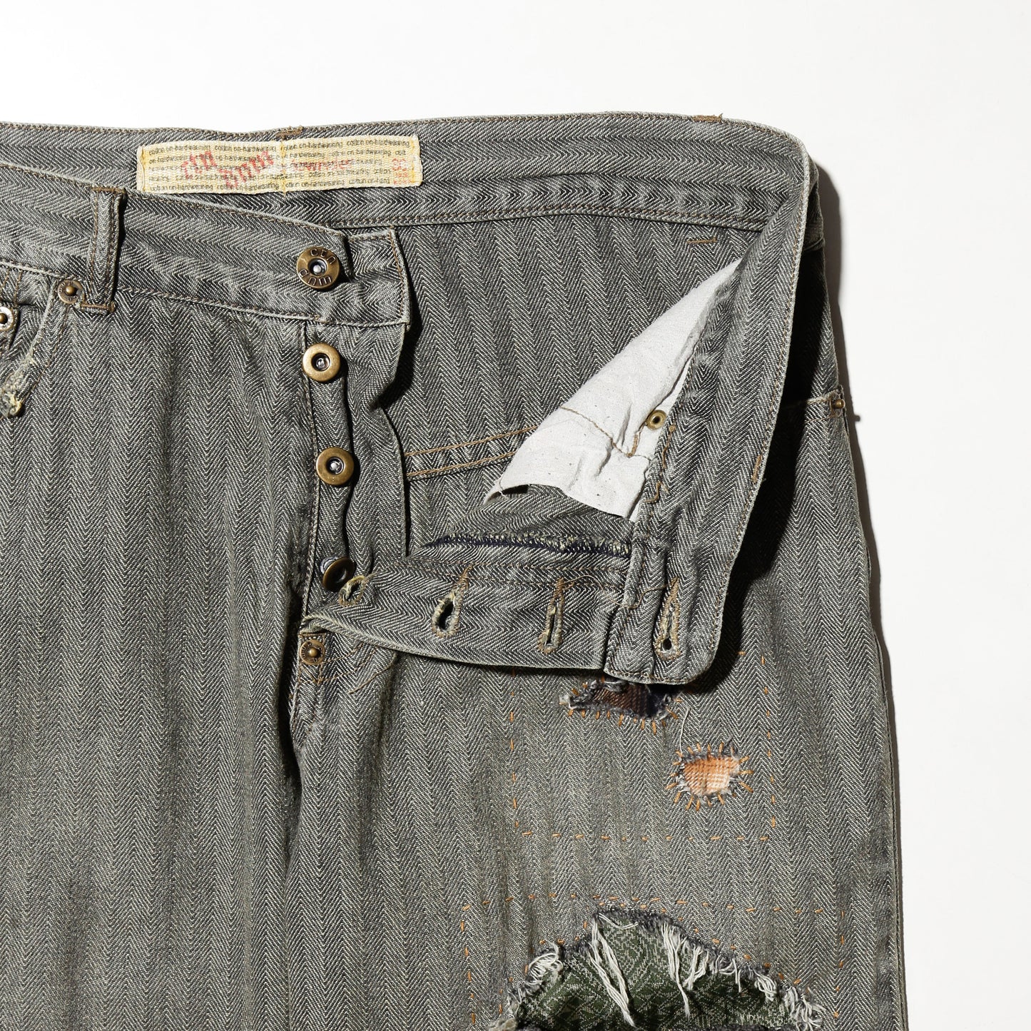 *one-off repaired herringbone jeans