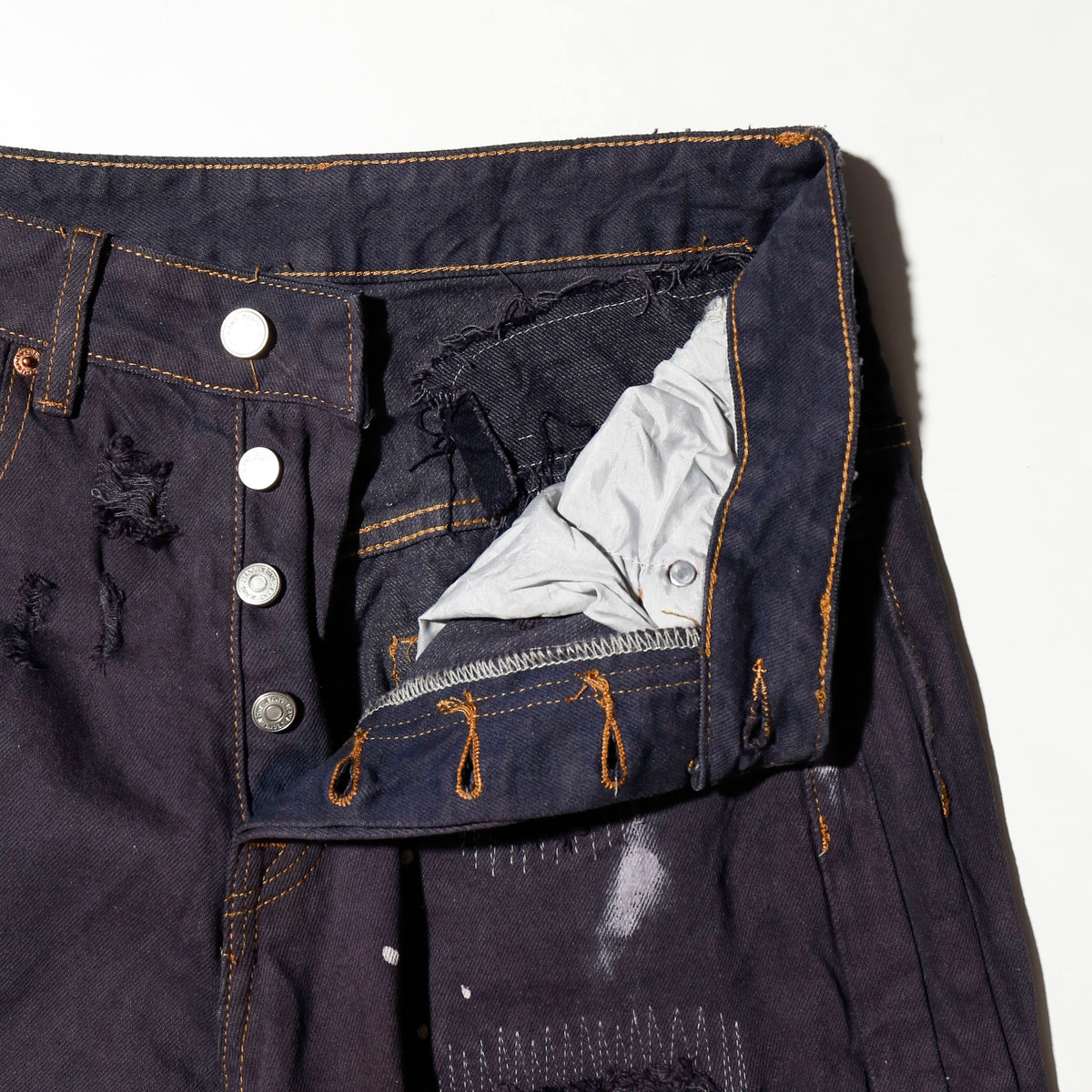 *one-off broken/repaired wide leg jeans