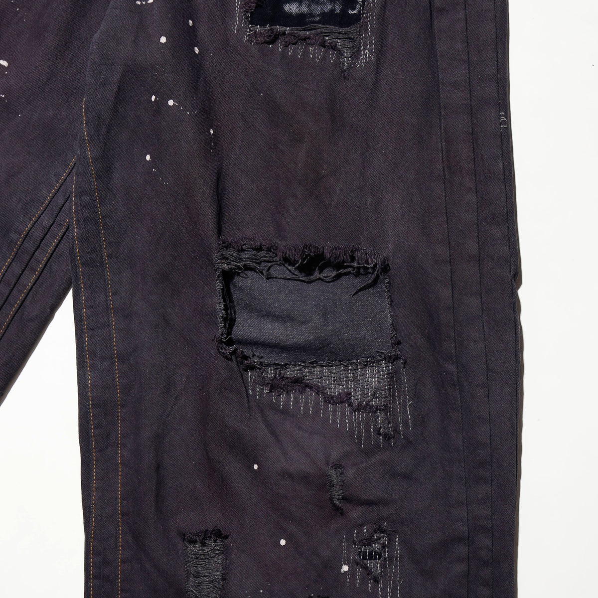 *one-off broken/repaired wide leg jeans