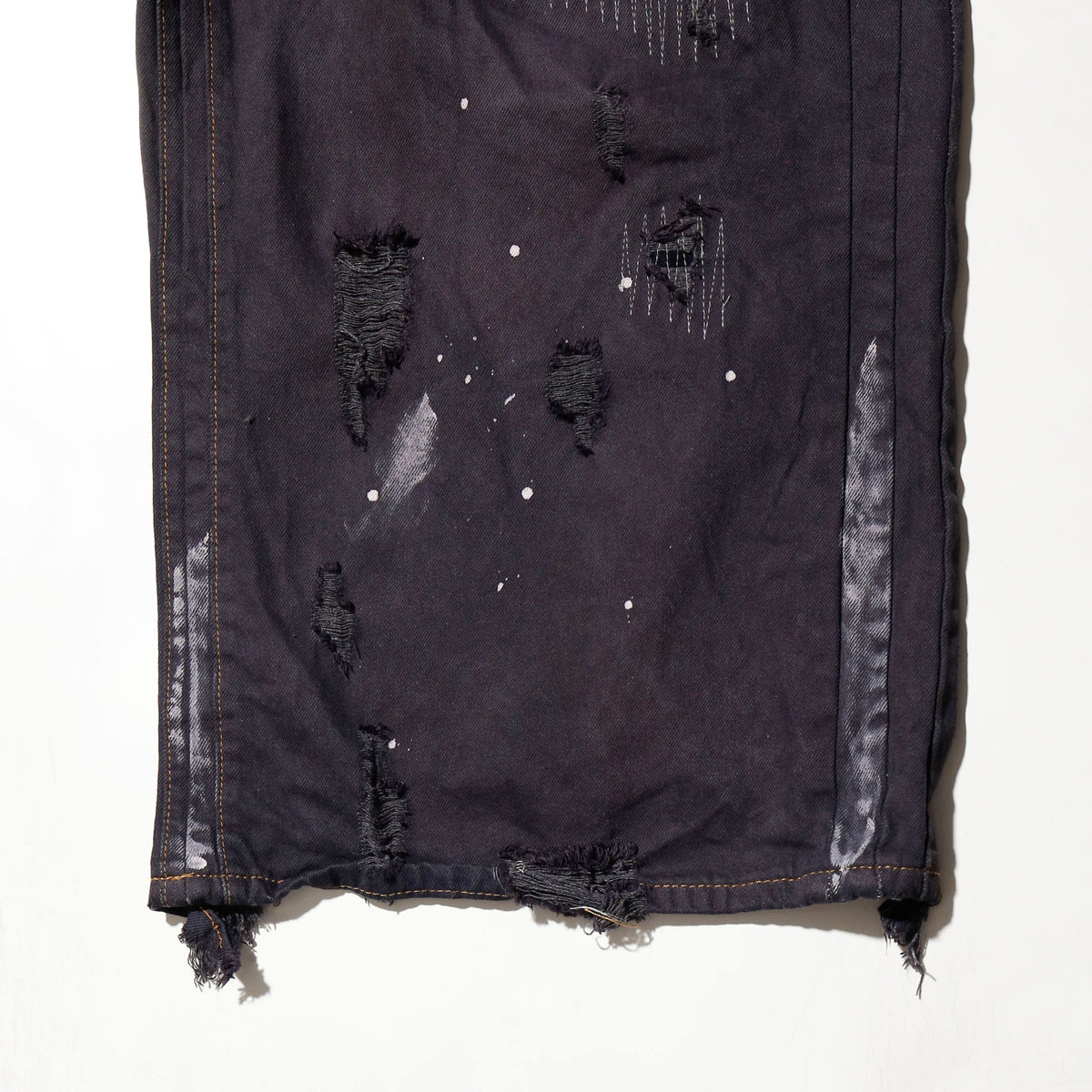 *one-off broken/repaired wide leg jeans