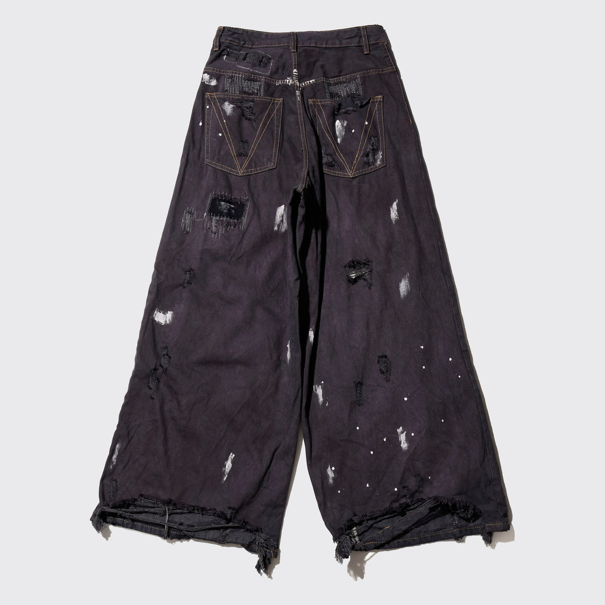 *one-off broken/repaired wide leg jeans