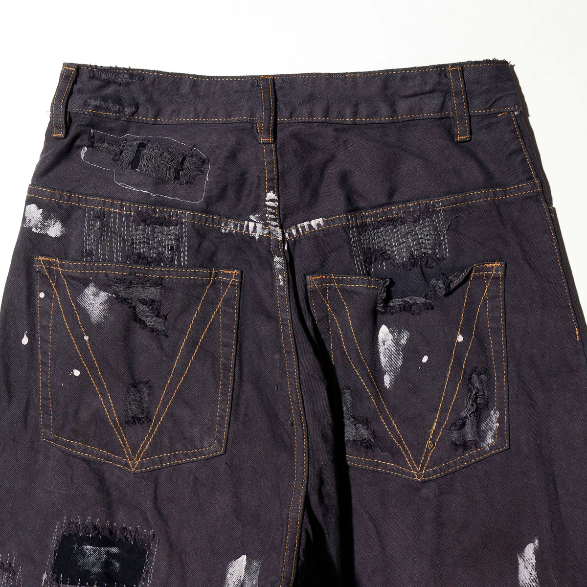 *one-off broken/repaired wide leg jeans