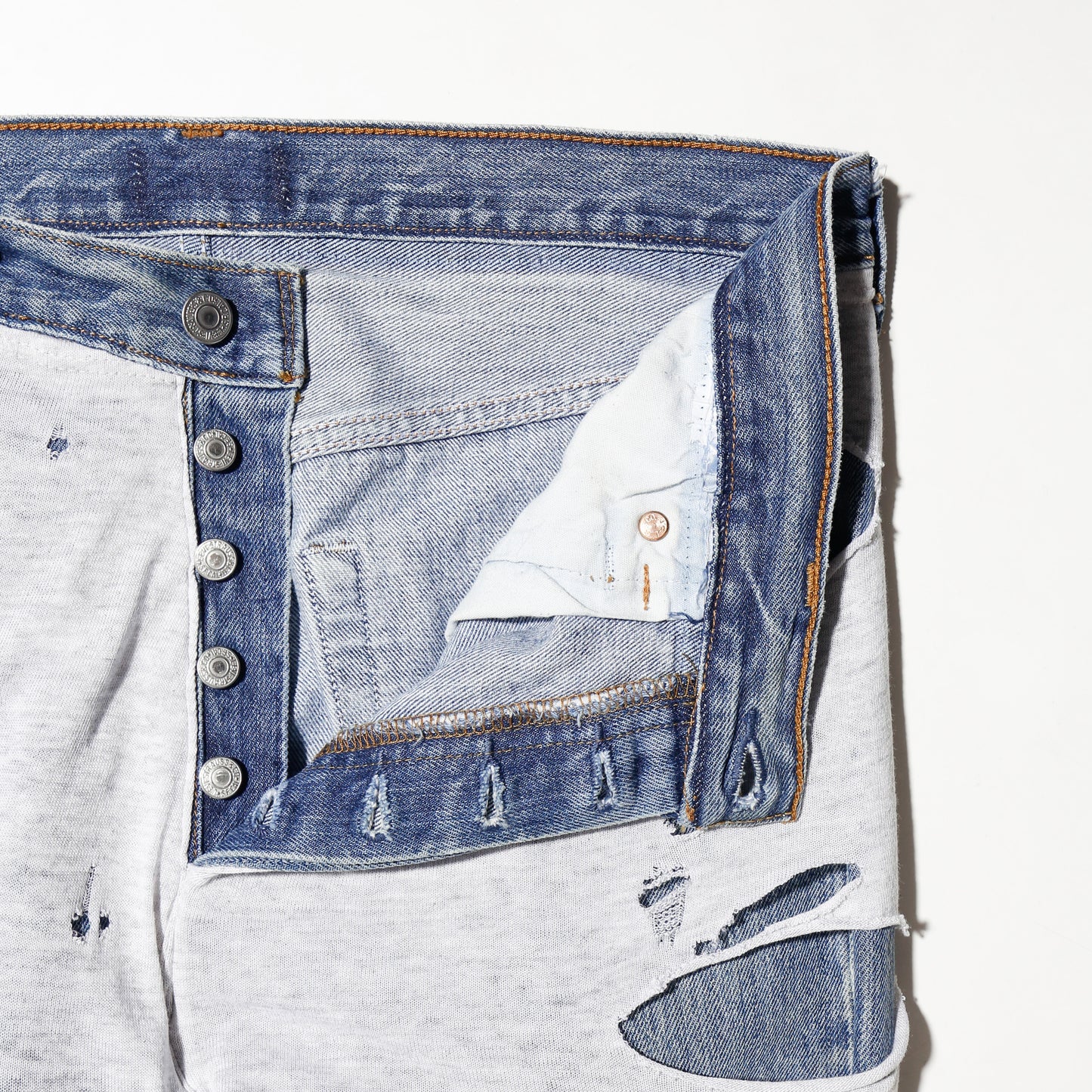 *one-off broken layered jeans