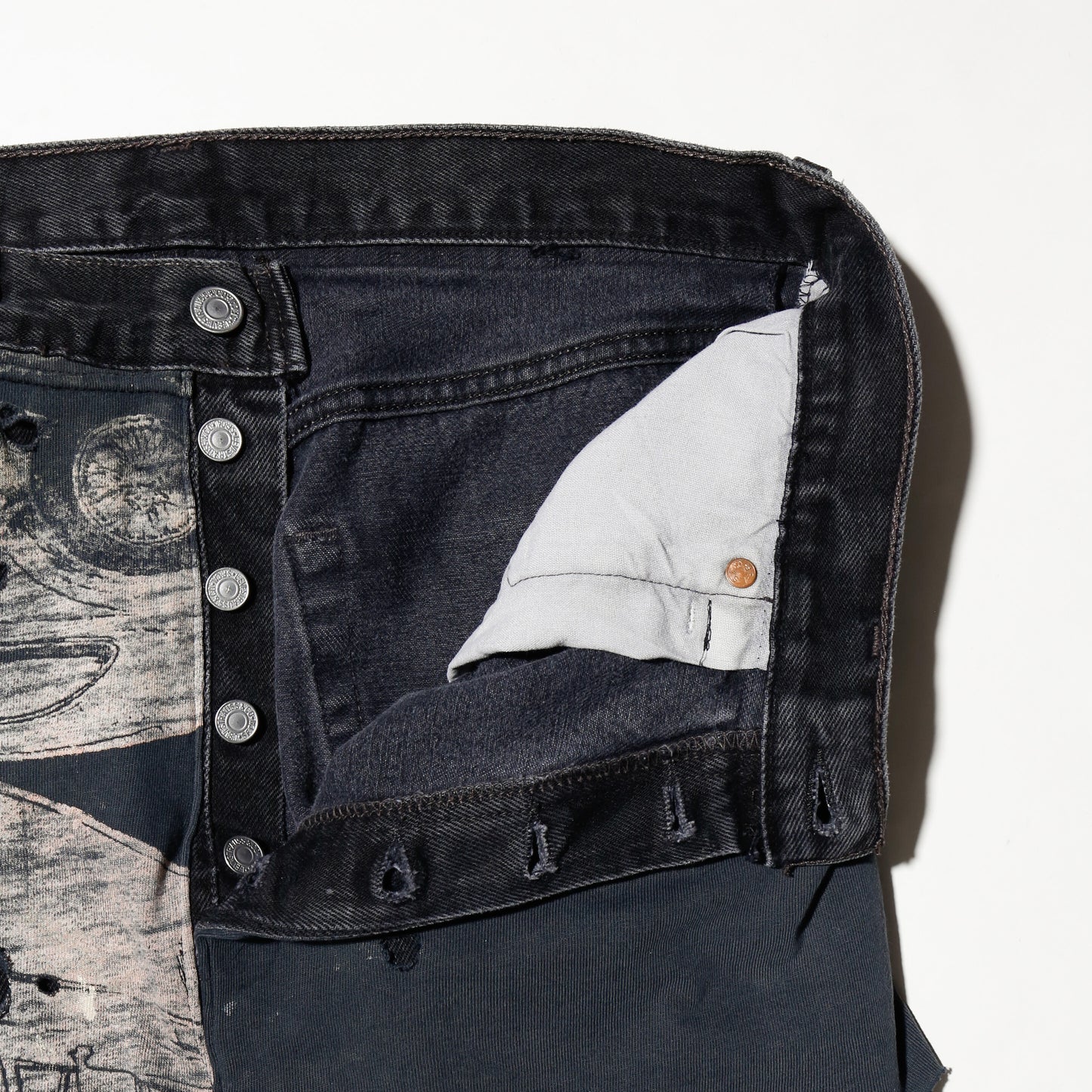 *one-off broken layered jeans