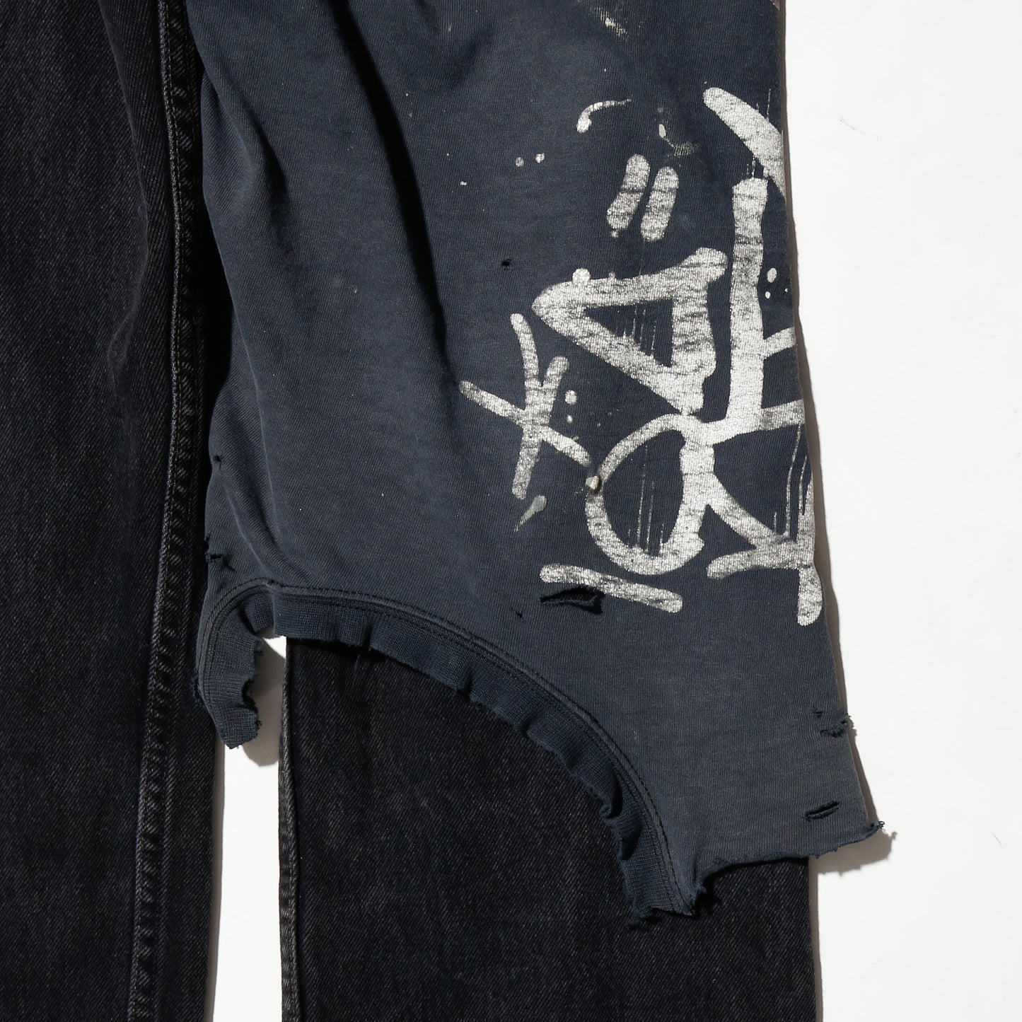 *one-off broken layered jeans