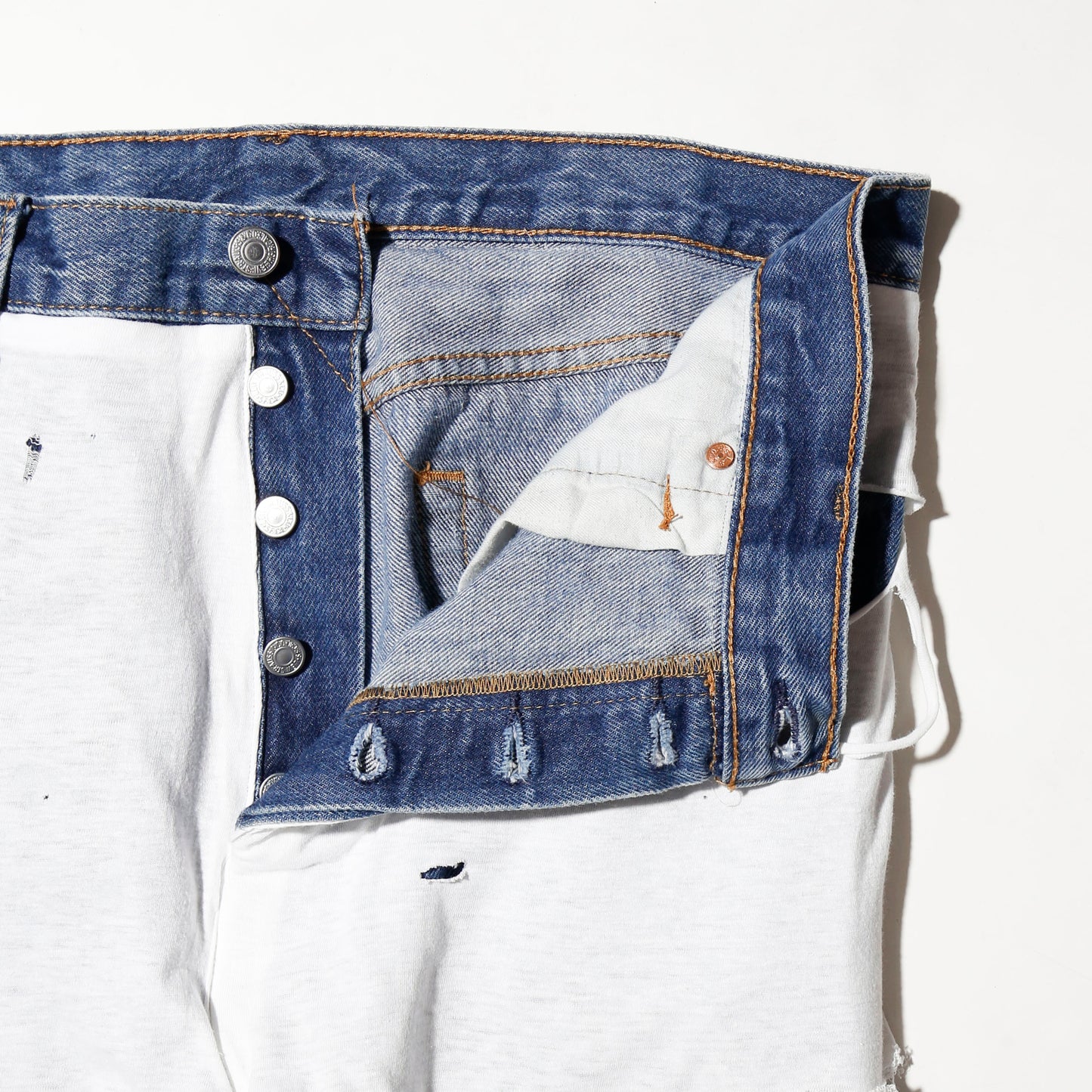 *one-off broken layered jeans