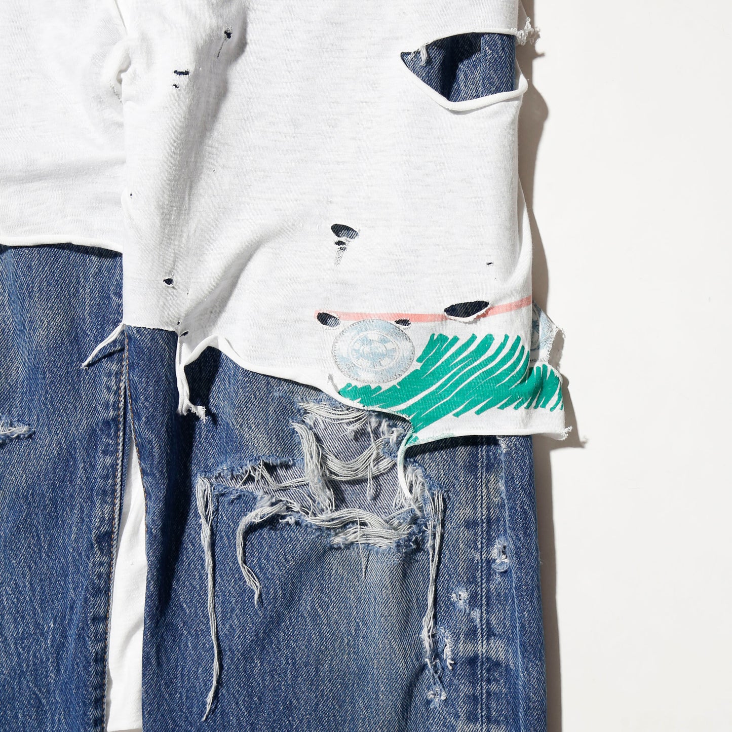 *one-off broken layered jeans
