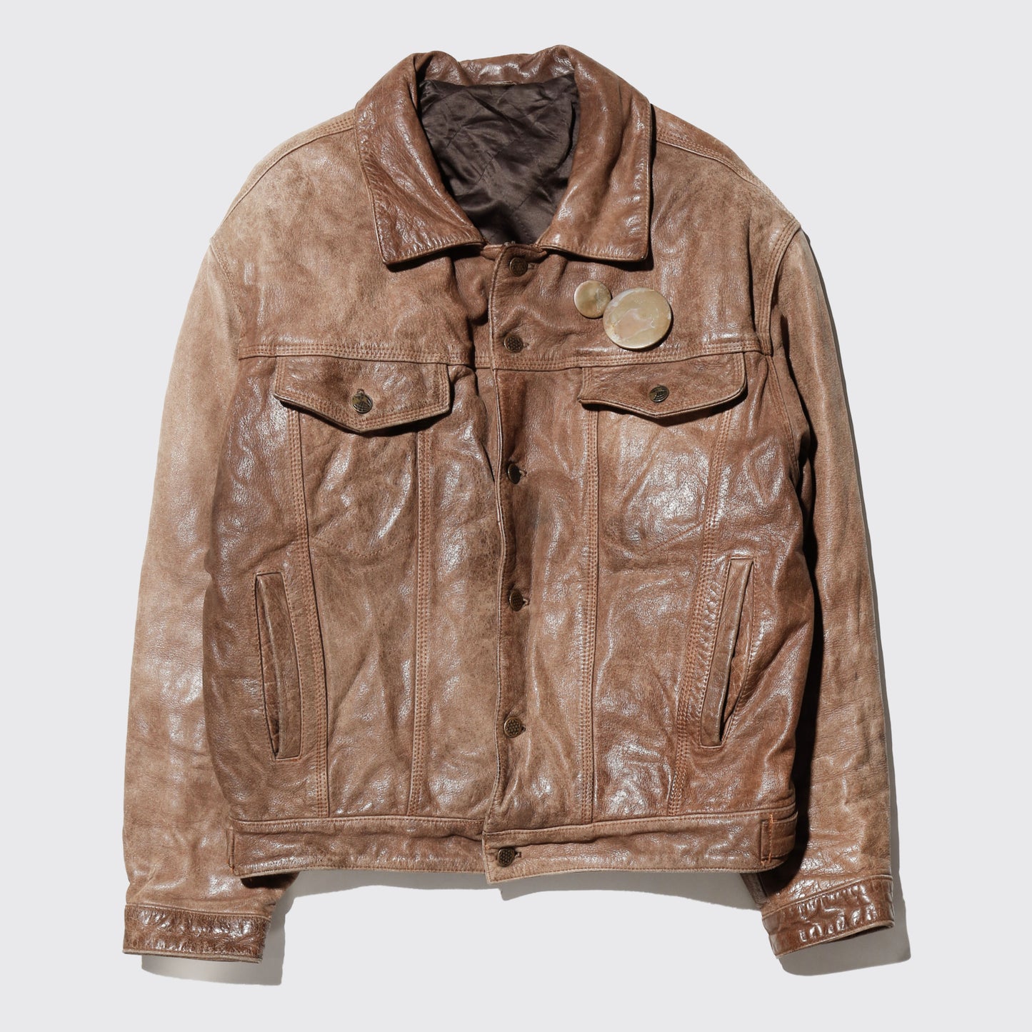 vintage faded leather trucker jacket , with aging kapper badge