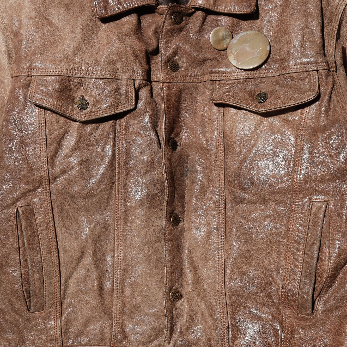 vintage faded leather trucker jacket , with aging kapper badge