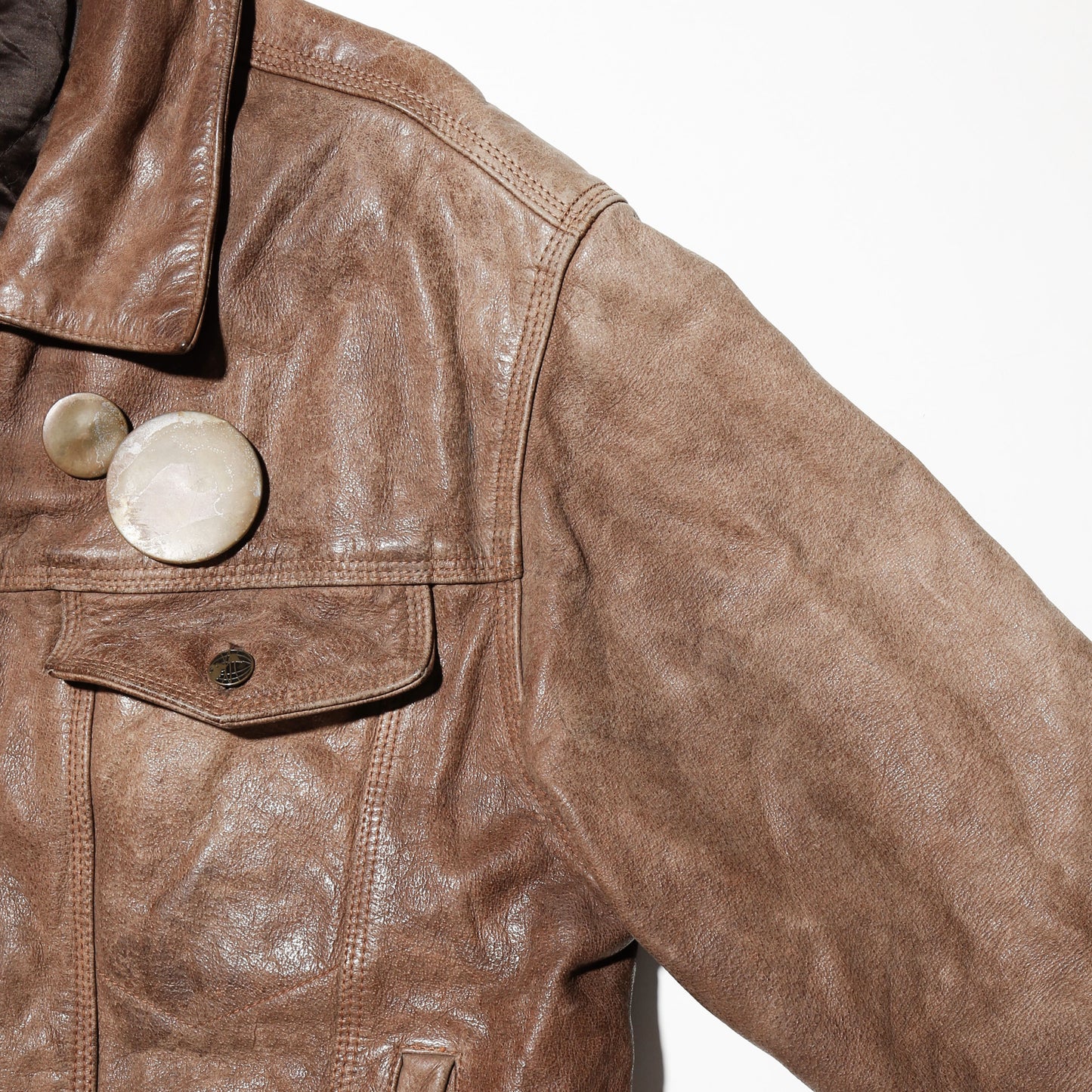 vintage faded leather trucker jacket , with aging kapper badge