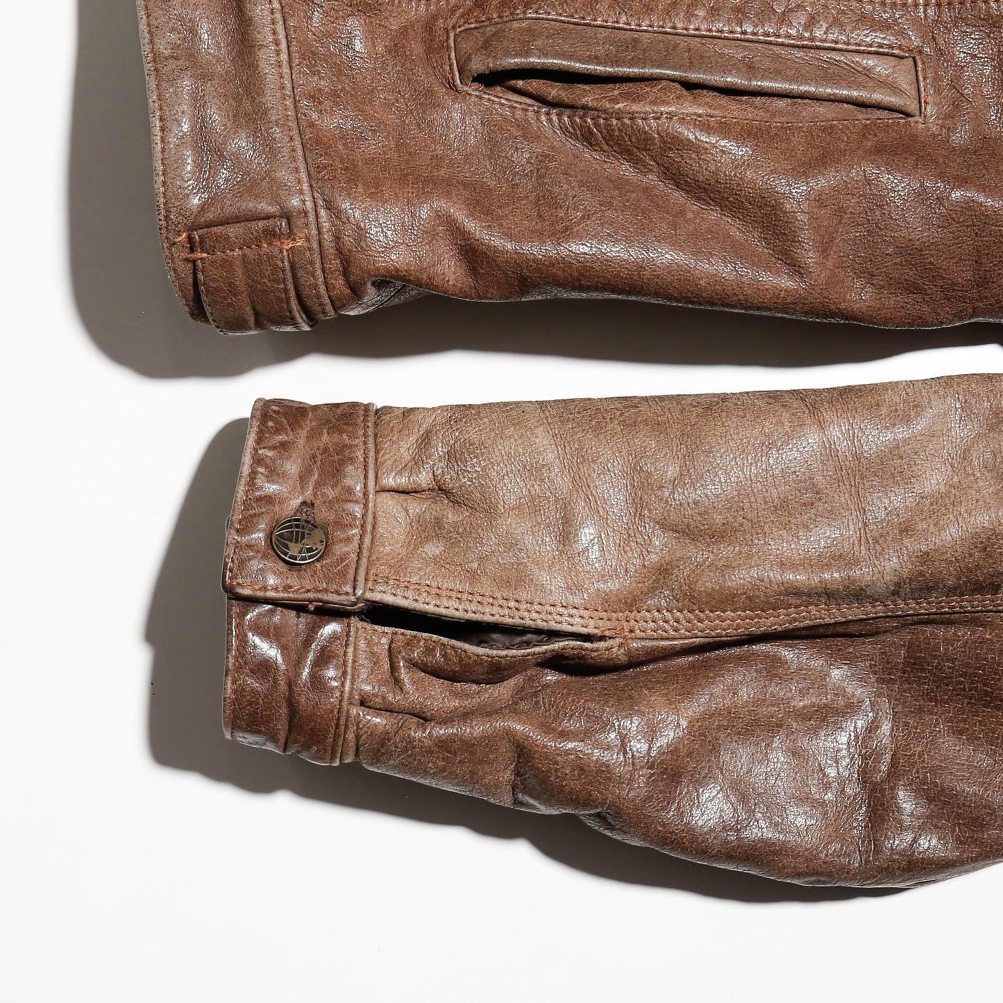 vintage faded leather trucker jacket , with aging kapper badge