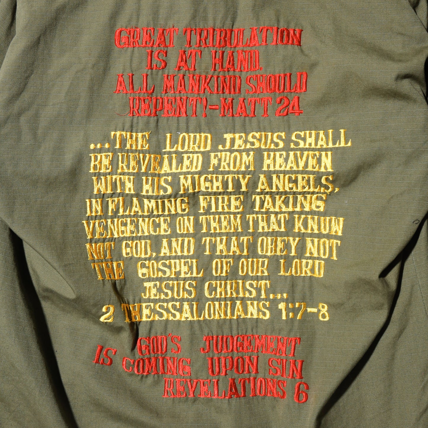 vintage 60's us army "Scriptures" broderied jungle fatigue jacket, with copper badge