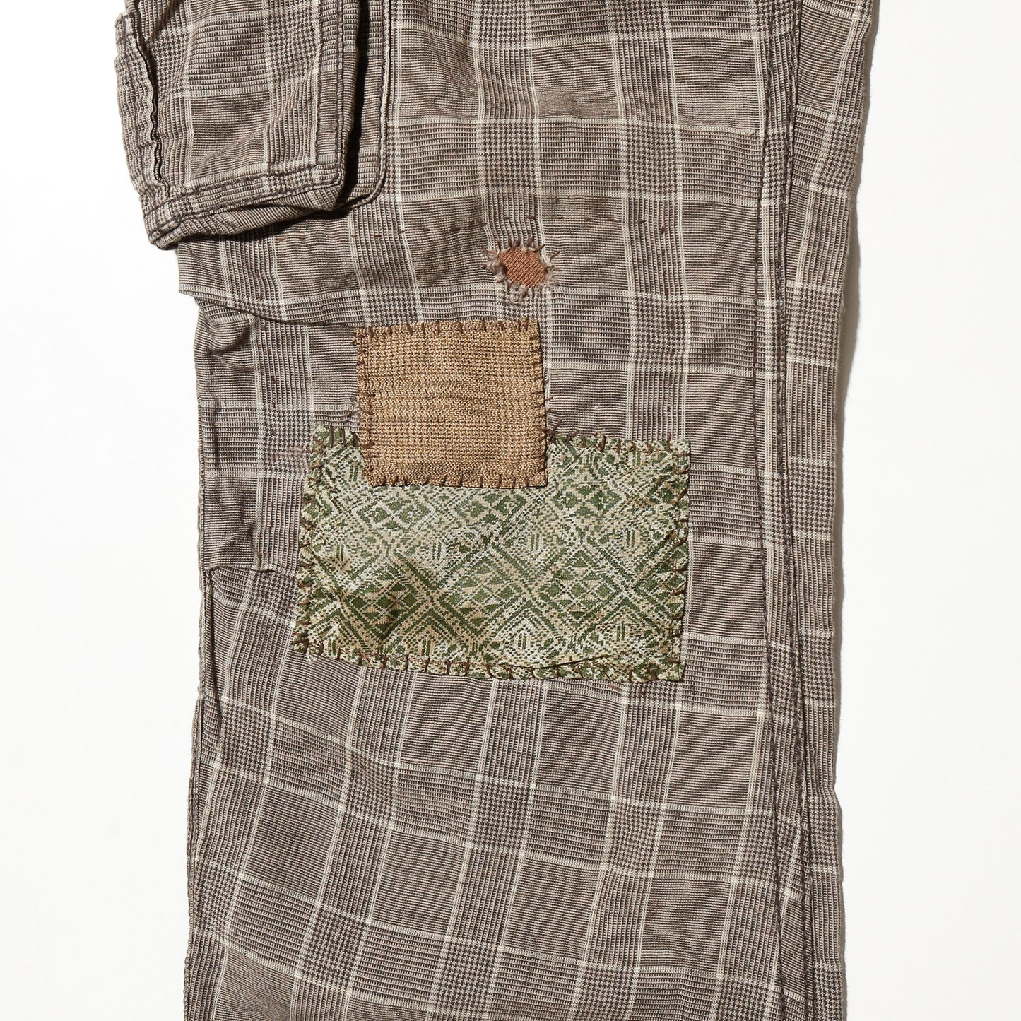 *one-off esplit repaired check cargo trousers