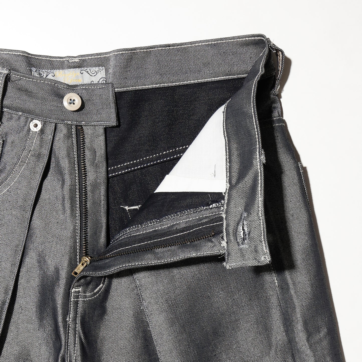 *one-off resized center tuck metalic baggy shorts
