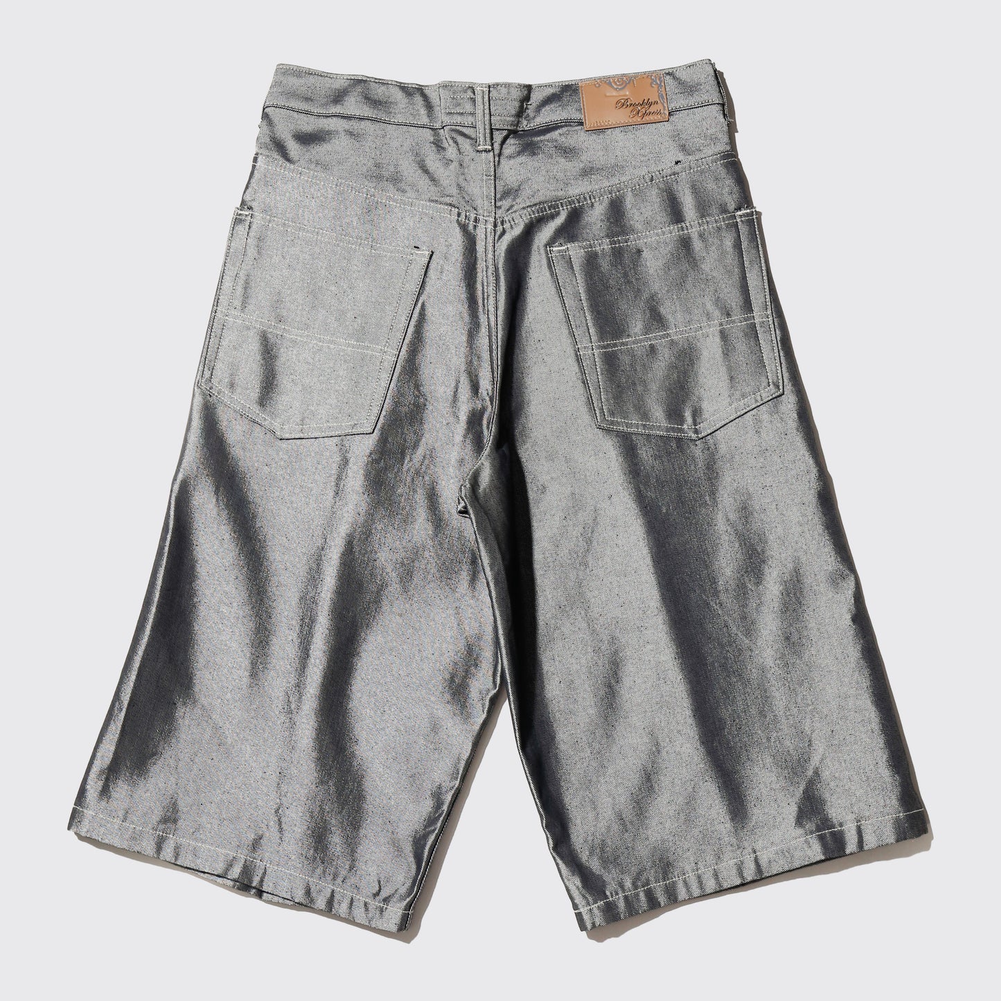 *one-off resized center tuck metalic baggy shorts