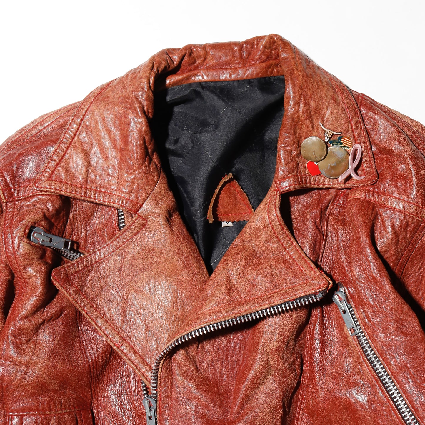 vintage reddish leather riders jacket , with badge