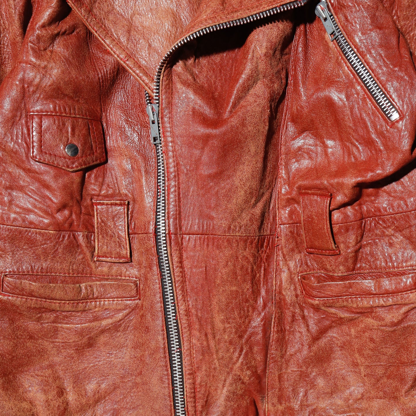 vintage reddish leather riders jacket , with badge
