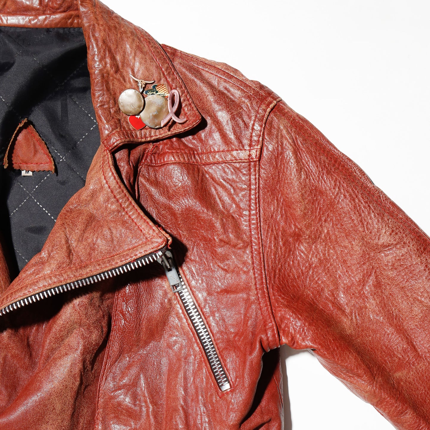 vintage reddish leather riders jacket , with badge
