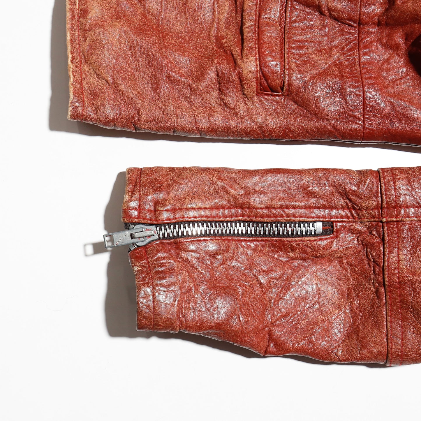 vintage reddish leather riders jacket , with badge