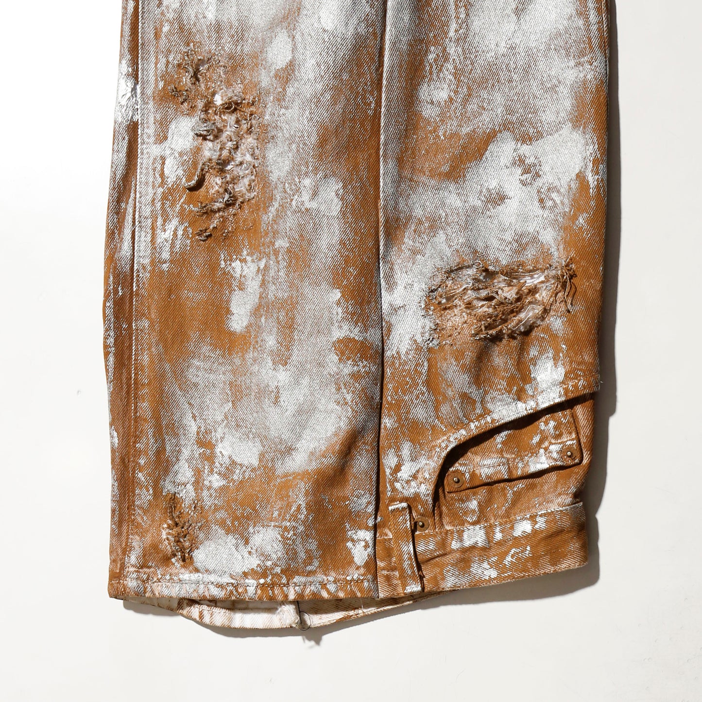 *one-off broken upside down jeans: model- silver dust camel